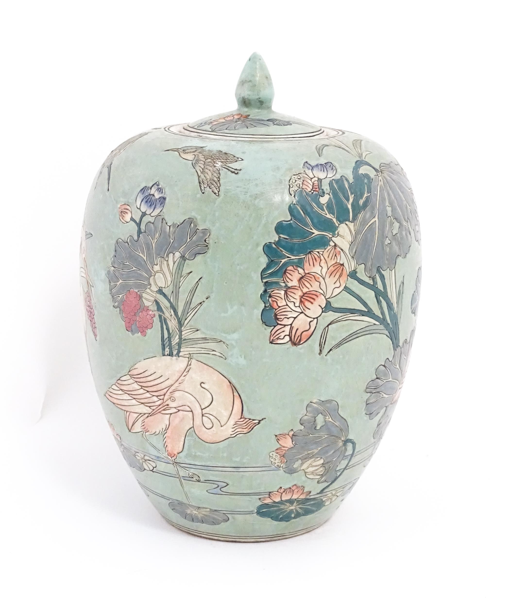 A Chinese ginger jar with celadon style glaze decorated with crane birds, flowers, lily pads, etc. - Image 5 of 8