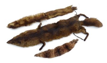 A quantity of furs, comprising fox, mink and racoon stoles, together with sections of fabric-