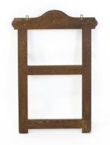 A 20thC oak whip rack with six shaped hooks. 21" wide x 30" high. Please Note - we do not make