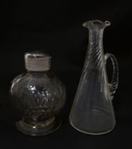 Two items of glassware to include a 19thC facet cut glass bottle of globular form with screw top and