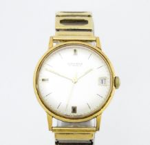 A gentleman's Junghans wristwatch with date aperture at 3, and Rowi-Fixo-Flex bracelet. Watch