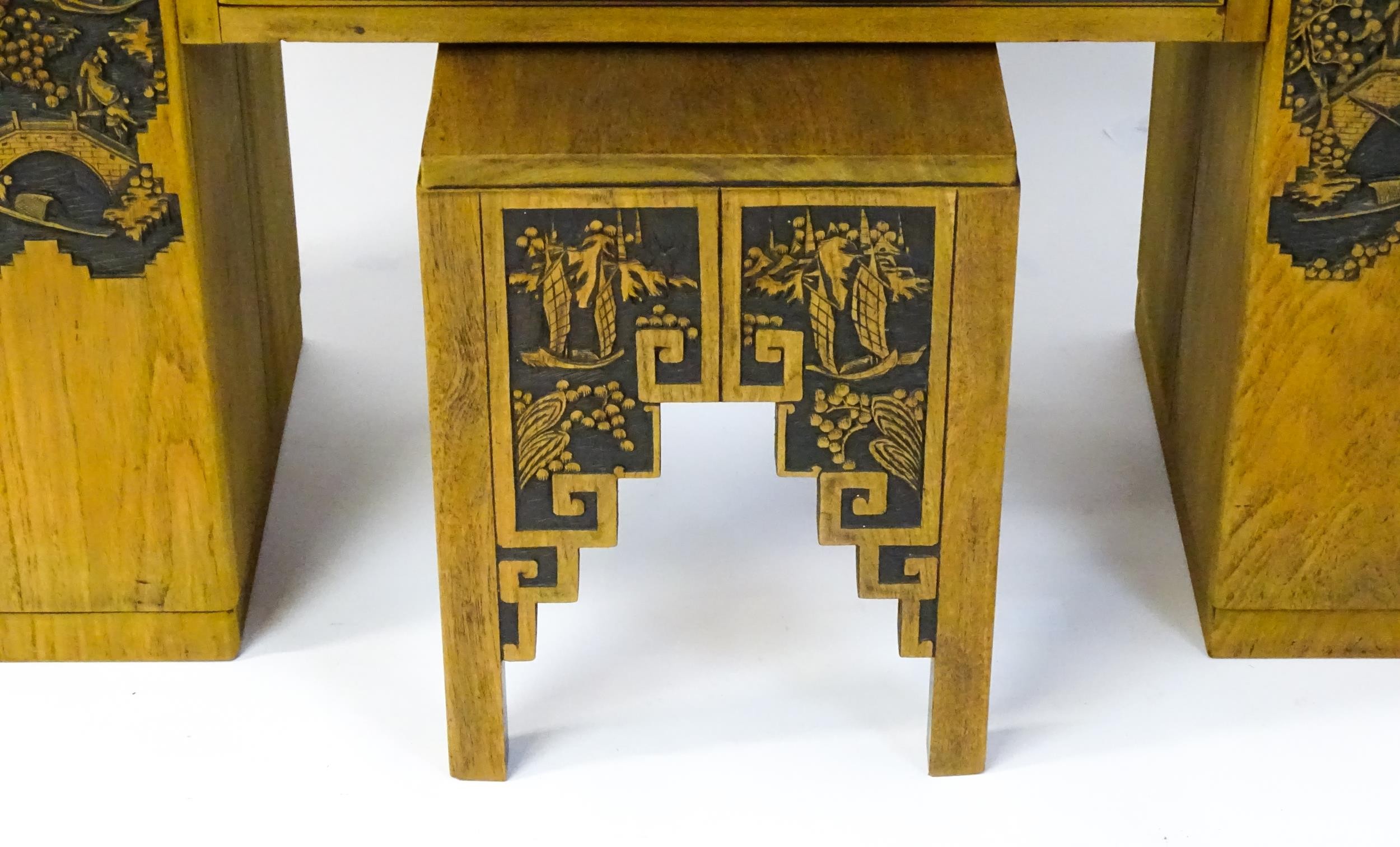 An early / mid 20thC Teak bureau accompanied by a stool, with carved oriental scenes to the front, - Image 10 of 12