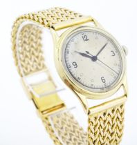 A Gentleman's Swiss 14k gold cased manual wind wrist watch. Approx 1 1/4" wide Please Note - we do