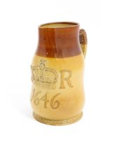 A Doulton Lambeth jug of leather jack form with commemorative CR cipher dated 1646. Marked under no.