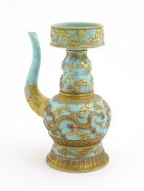 A Chinese wine ewer with funnel cover, the turquoise ground decorated with gilt dragons and bats