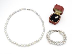 Pearl jewellery comprising a two strand bracelet with silver clasp, a necklace with silver clasp and