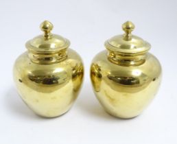 A pair of Chinese brass lidded ginger jars. Character marks under. Approx. 7 1/2" high (2) Please