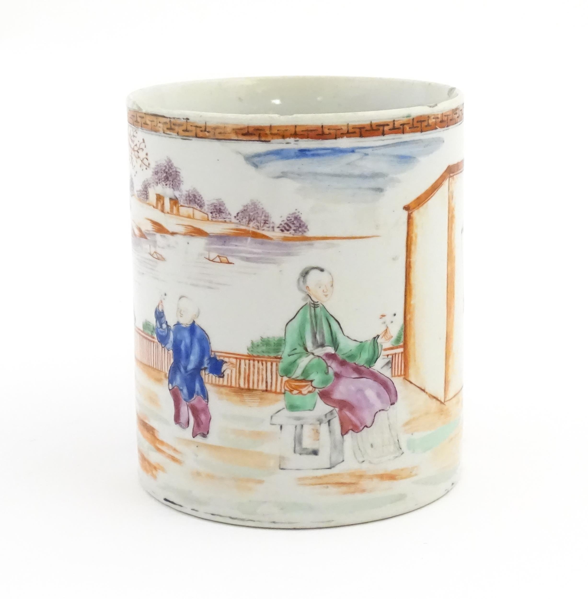 A large Chinese famille rose tankard decorated with figures in a landscape scene. Approx. 5 3/4" - Image 2 of 7