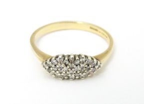 A 9ct gold diamond cluster ring. Ring size approx. N 1/2. Please Note - we do not make reference