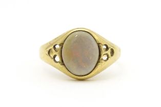 A 9ct gold signet ring set with central opal cabochon. Ring size approx. P Please Note - we do not