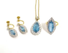 An 18ct gold suite of jewellery comprising ring, pendant necklace and drop earrings, all set with