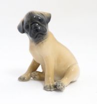 A Royal Copenhagen model of a Pug dog, model no. 3169. Approx. 3 1/4" high Please Note - we do not