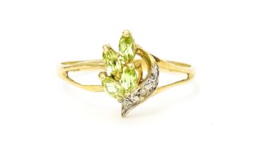 A 9ct gold ring set with peridot and diamonds. Ring size approx. O Please Note - we do not make