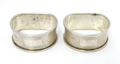 Two silver napkin rings with engine turned decoration. Hallmarked Birmingham 1959/60 maker W I