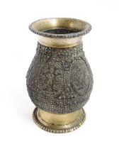 An Indian brass vase with banded figural and floral detail. Approx. 4 1/2" high Please Note - we