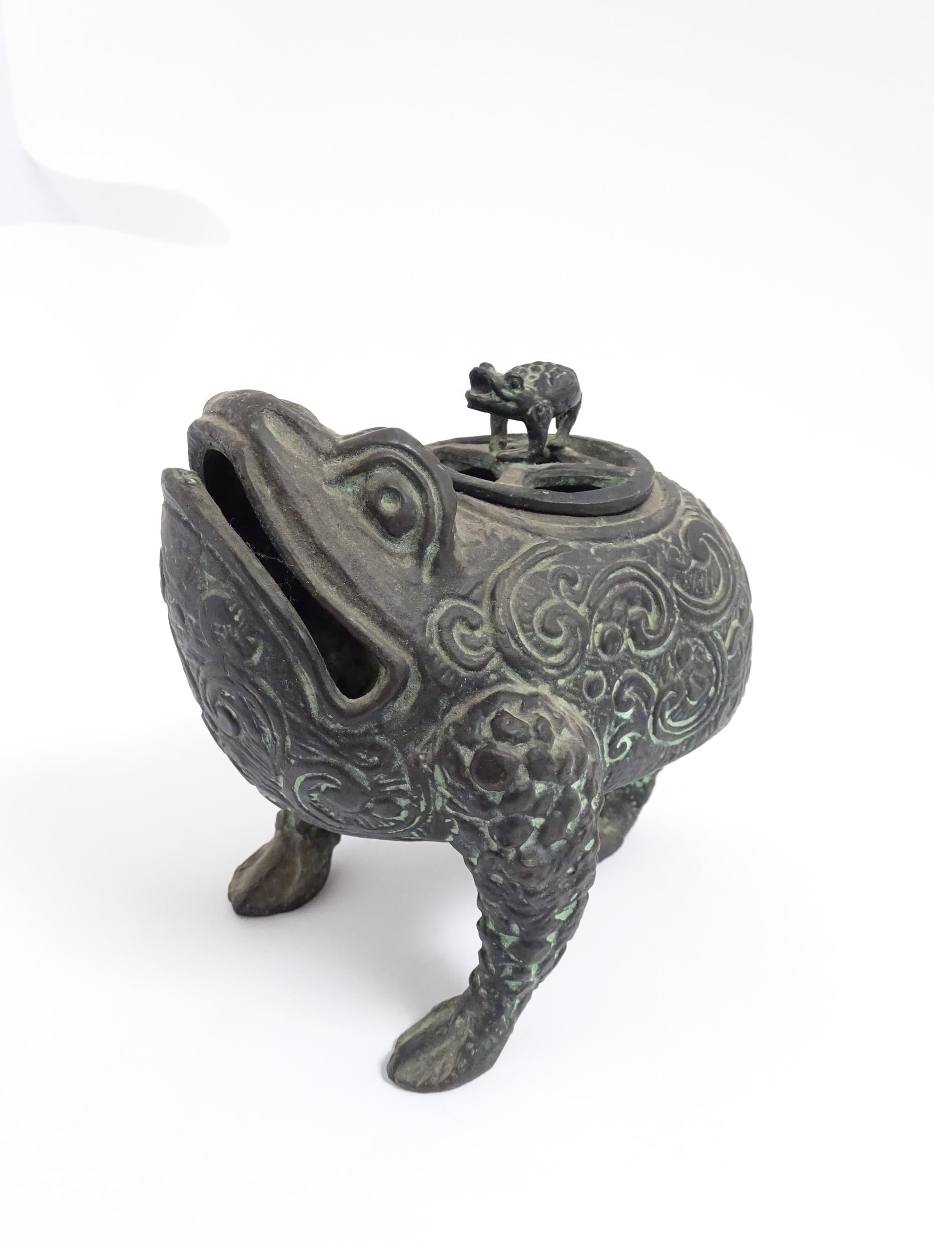 A Chinese cast censer modelled as a three legged toad with scrolling decoration, the pierced lid - Image 3 of 8