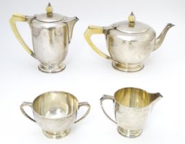 An Art Deco silver four piece tea set hallmarked London 1934/35 with jubilee mark, maker Edward