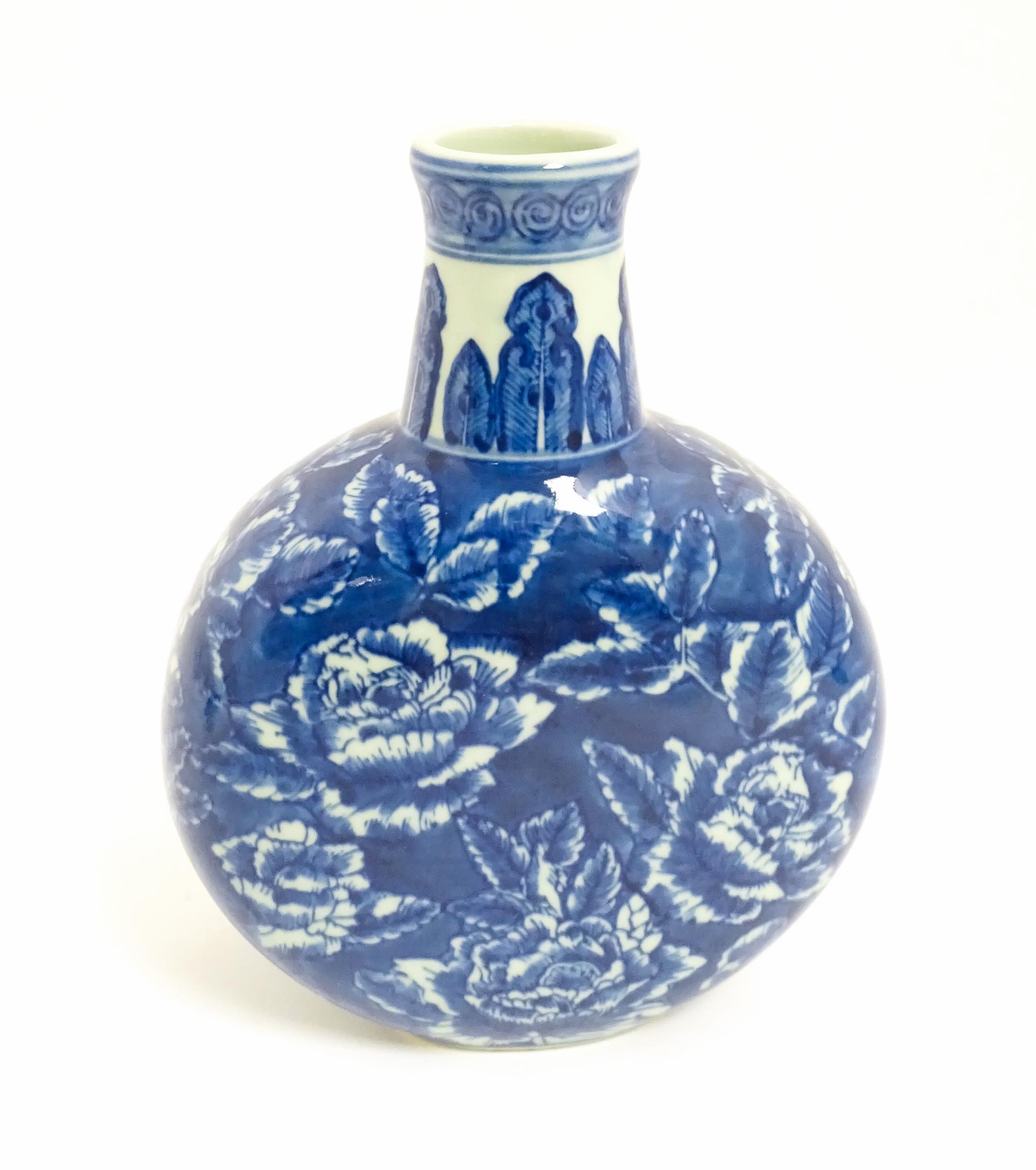 A Chinese blue and white moon vase with floral and foliate decoration. Approx. 10 1/4" high Please - Image 3 of 7