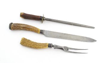 A Victorian carving knife and fork with antler handles and silver collar. Together with an antler