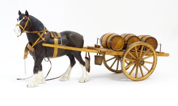 A Beswick Clydesdale harnessed horse model no. 2465 with wooden cart and three barrels. Approx. 22