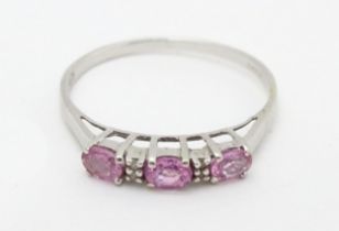 A 9ct white gold ring set with pink sapphires and diamonds. Ring size approx. R Please Note - we