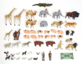 Toys: A quantity of 20thC cast model animals to include giraffes, elephants, camels, lions, tiger,