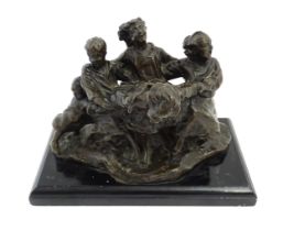 An early 20thC bronze figural group modelled as children playing. Raised on a rectangular wooden
