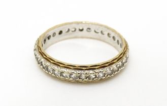 A 9ct gold eternity ring set with white stones. Ring size approx. K 1/2 Please Note - we do not make