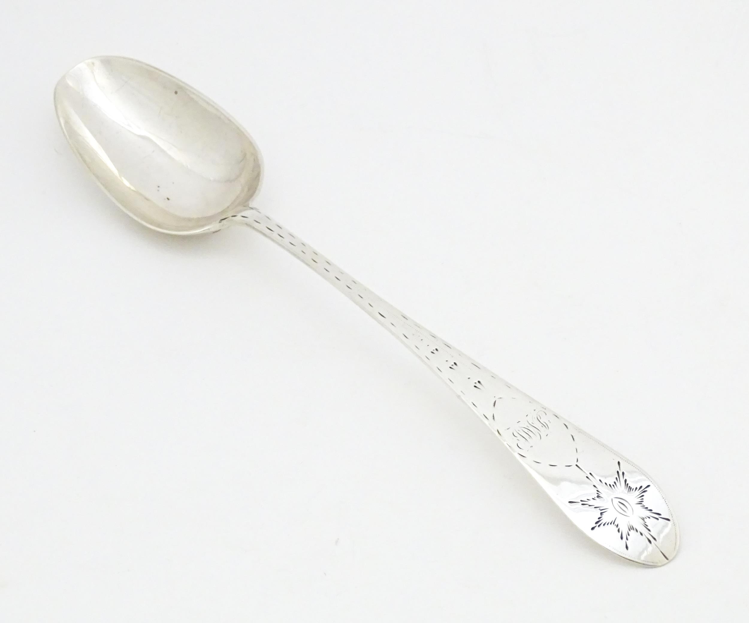 An early 19thC provincial Irish silver table spoon with bright cut decoration, maker Carden