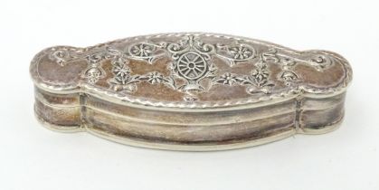 A silver pill box of shaped form. Approx. 2 1/4" wide Please Note - we do not make reference to