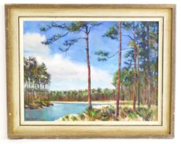 Joan Cavalier, 20th century, Oil on canvas, A lake scene bordered by pine trees. Signed lower