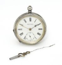 A Continental .935 silver cased pocket watch with white enamel dial having Roman numerals and