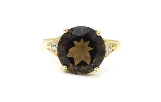 A 9ct gold ring set with smoky topaz and diamonds. Ring size approx. M Please Note - we do not