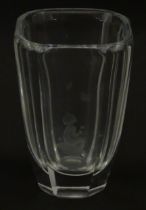 Scandinavian art glass: An Orrefors glass vase with etched girl and butterfly detail. Signed
