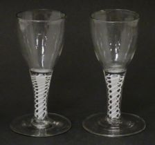 Two 18th / 19thC pedestal drinking glasses with twist detail to stems. Approx. 5" high (2) Please