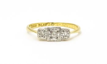 An Art Deco 18ct gold and platinum ring. set with three diamonds. Ring size approx. J. Please Note -