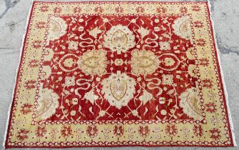 Carpet / Rug : A red ground rug with cream beige borders and floral and foliate detail. ' Palazzo