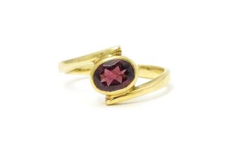 A 9ct gold ring set with oval garnet. Ring size approx. Q Please Note - we do not make reference