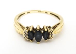 A 9ct gold ring set with sapphires and diamonds. Ring size approx. O Please Note - we do not make