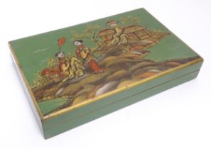 A 20thC cigarette box with chinoiserie decoration depicting two figures in a landscape with pagoda