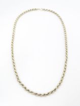 A silver necklace of rope twist form. Approx 28" long Please Note - we do not make reference to