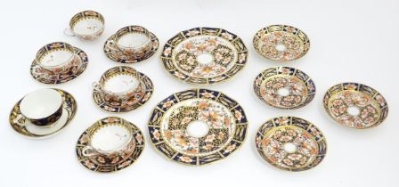 A quantity of Derby tea wares decorated in the Imari pattern to include cups, saucers, plates,