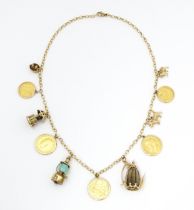 A 9ct gold and yellow metal chain necklace set with three sovereigns in captive mounts, and two half