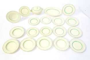A quantity of Clarice Cliff Art Deco dinner wares with green and gilt banded detail to include
