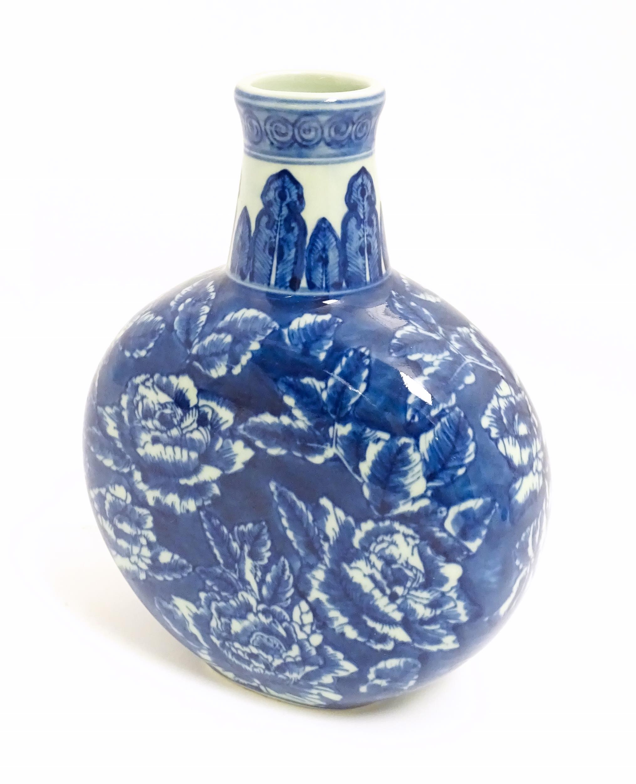 A Chinese blue and white moon vase with floral and foliate decoration. Approx. 10 1/4" high Please - Image 4 of 7