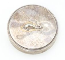 A Danish silver pot and cover / compact of circular form with stylised dolphin detail to lid.