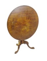 An 18thC mahogany tripod table with a one plank top, the table with a turned tapering pedestal and