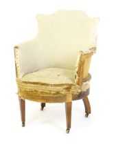 An Edwardian armchair chair by Cornelius V Smith, stamped C.V.S and raised on tapering front legs
