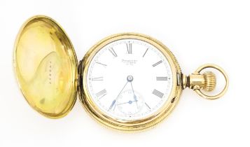 A gold plated Waltham hunter pocket watch, the dial with Roman numerals and subsidiary seconds dial.