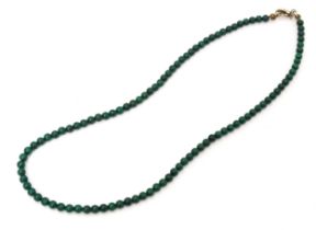 A green malachite coloured bead necklace. Approx. 16" long Please Note - we do not make reference to